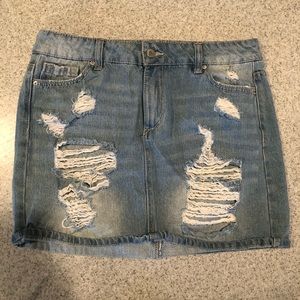Ripped, denim mini skirt.